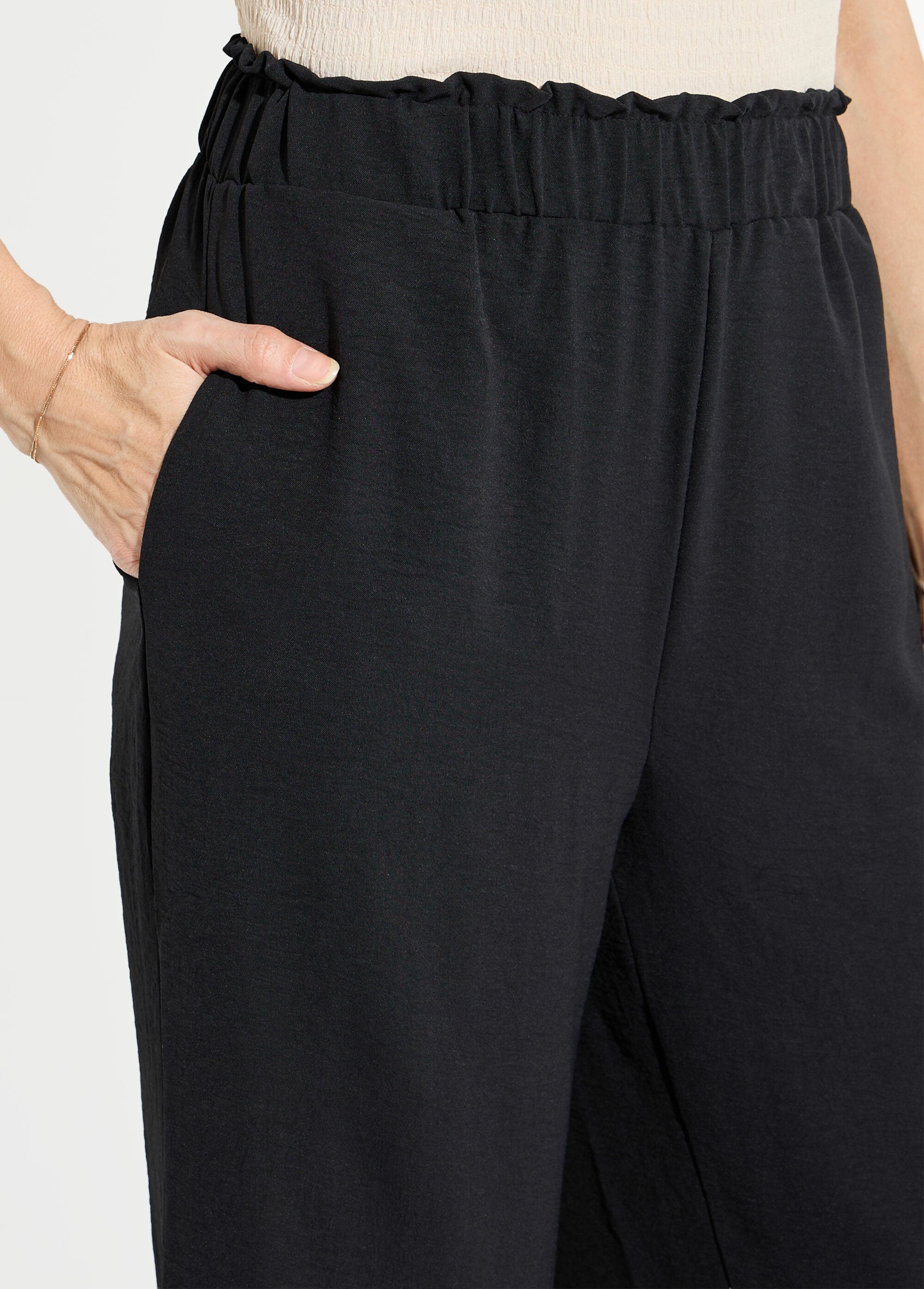 Pantalones_de_crepé_fluidos_de_pierna_ancha_Negro_DE1_slim